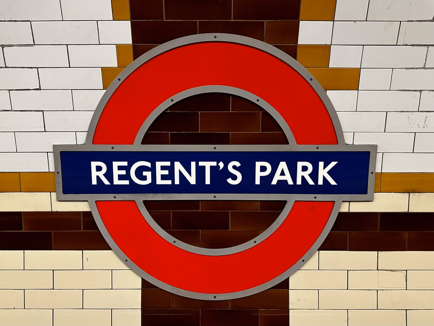 Regent’s Park London Underground roundel mounted on a tiled station wall