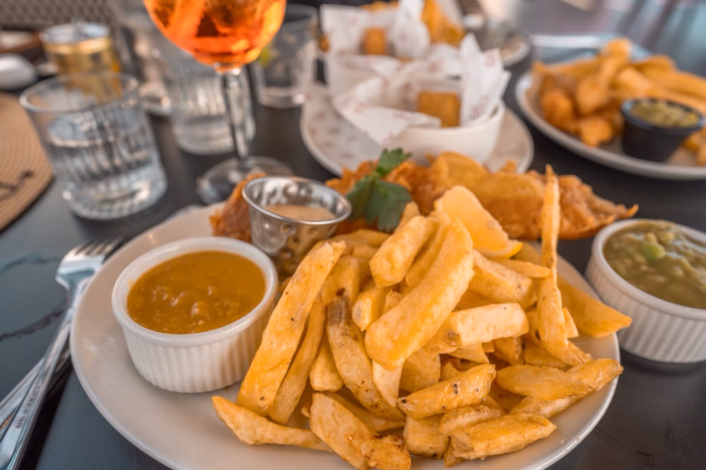 Chunky chips with curry sauce and mushy peas at Harry's, Bournemouth