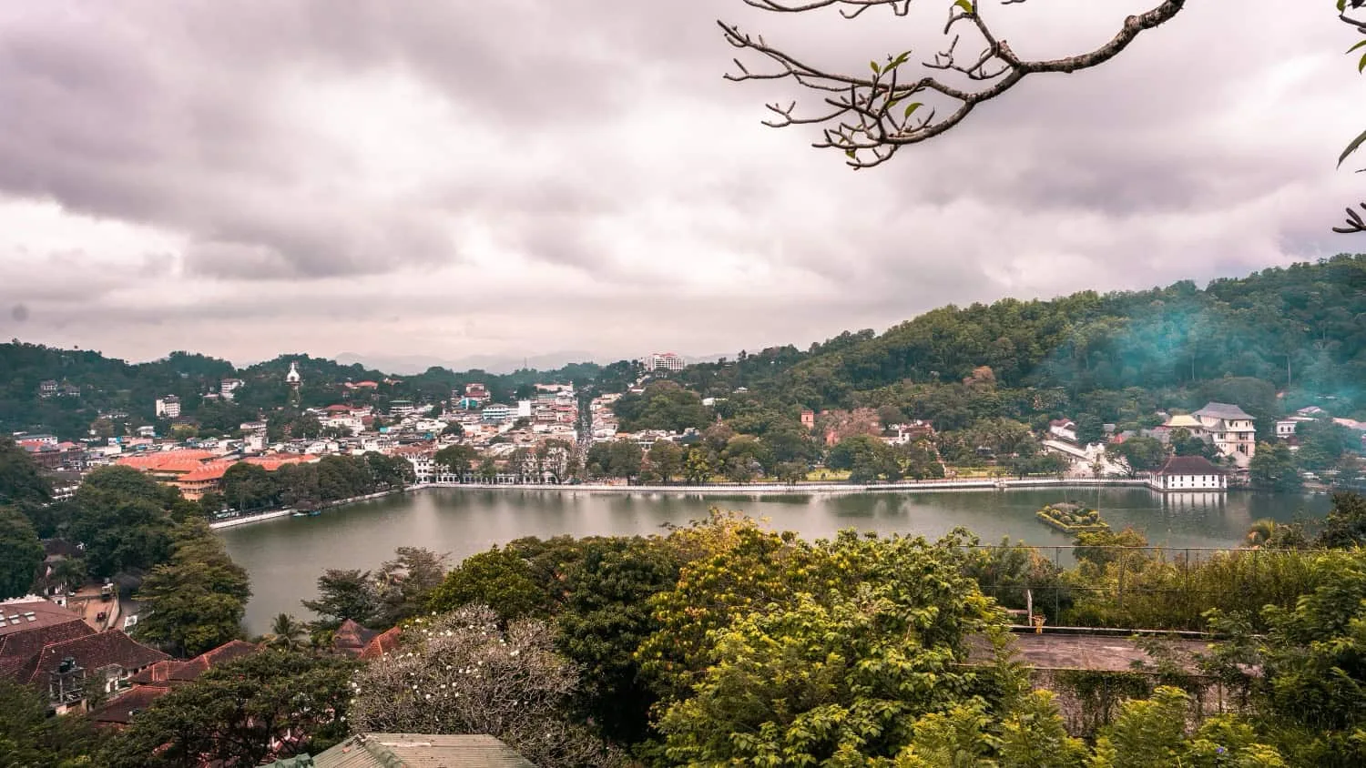 Scenic lake view surrounded by hills.