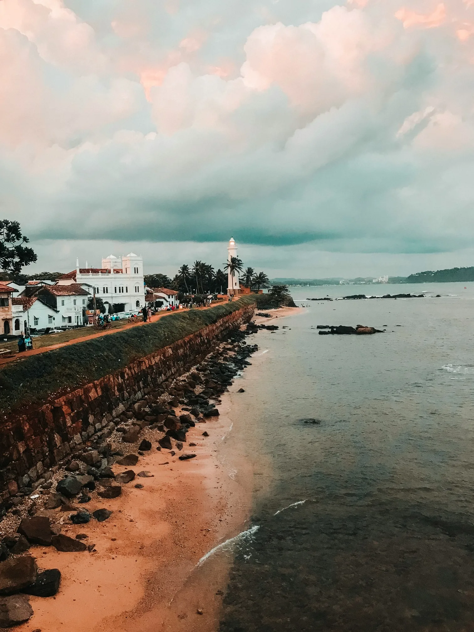 Coastal view with lighthouse and buildings