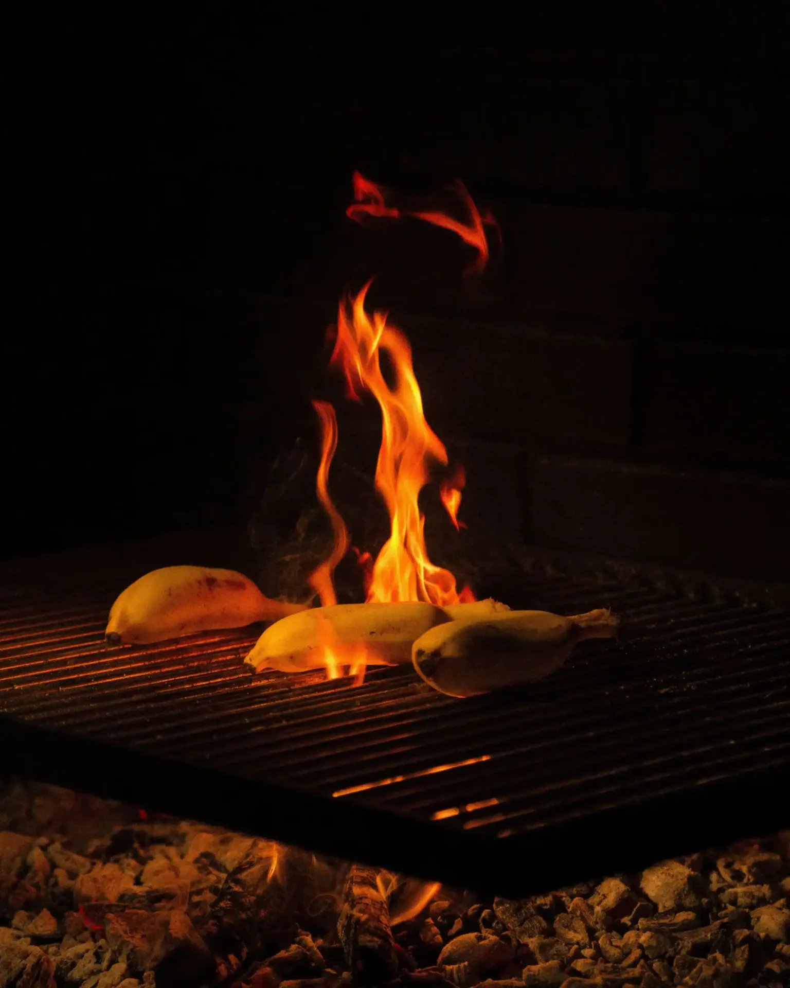 Flames rising from grilled chicken