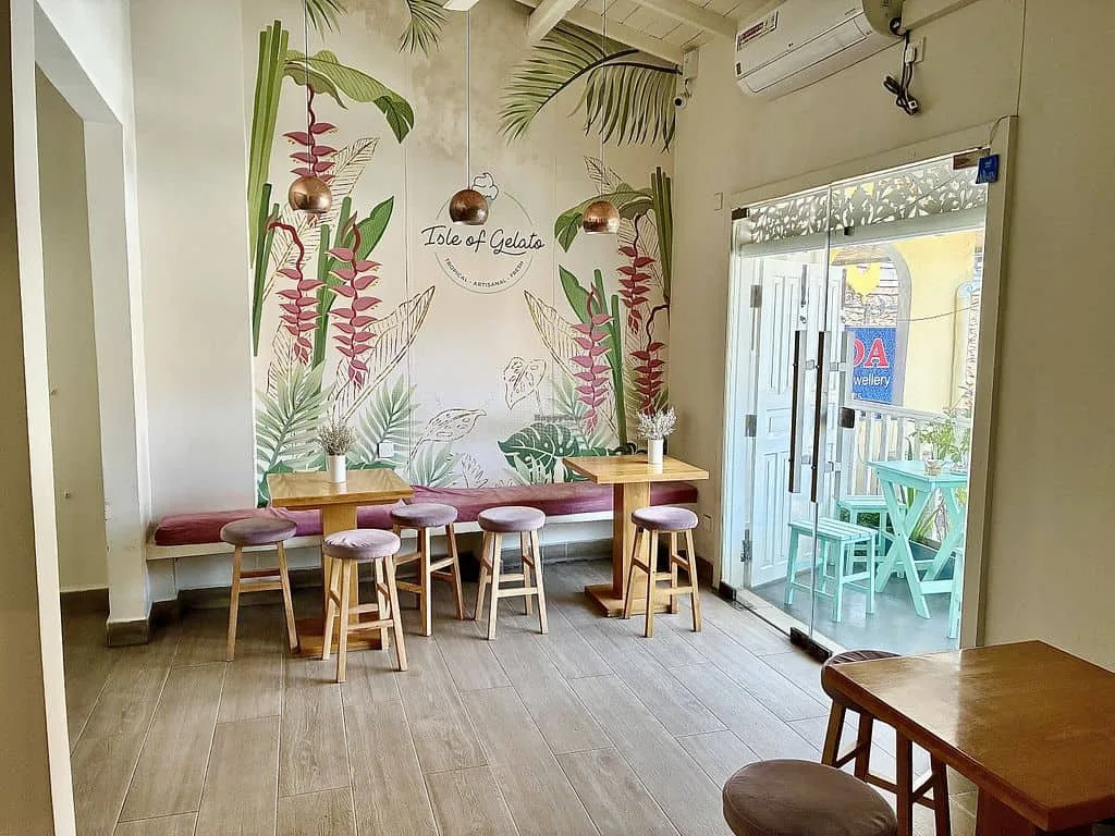 Bright café with tropical decor.