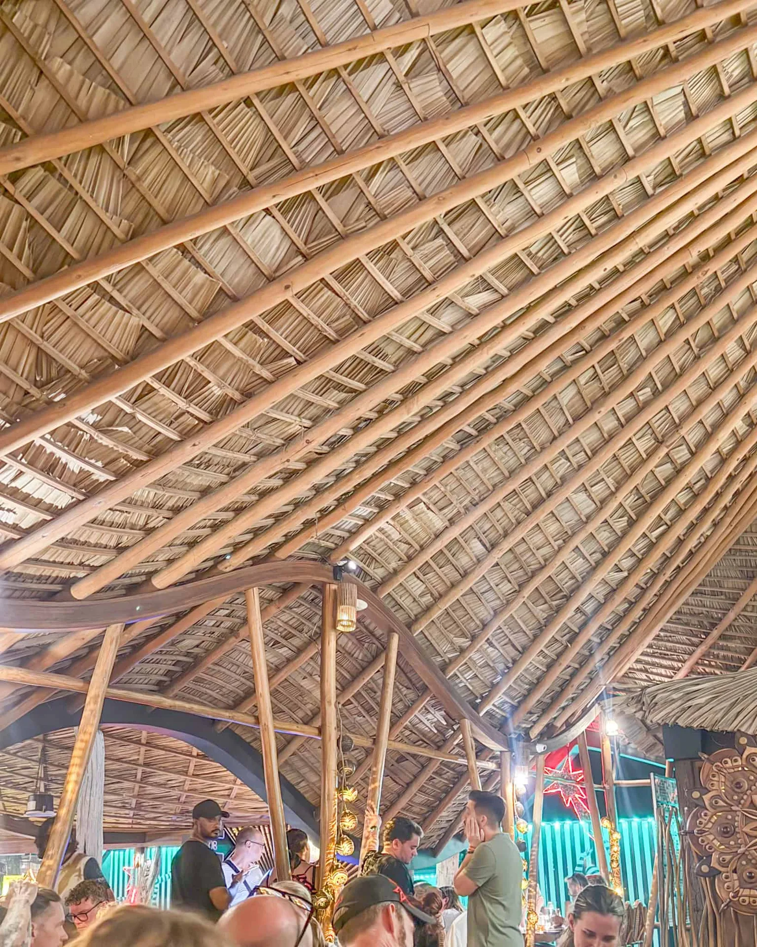 Rustic café interior with bamboo roof.