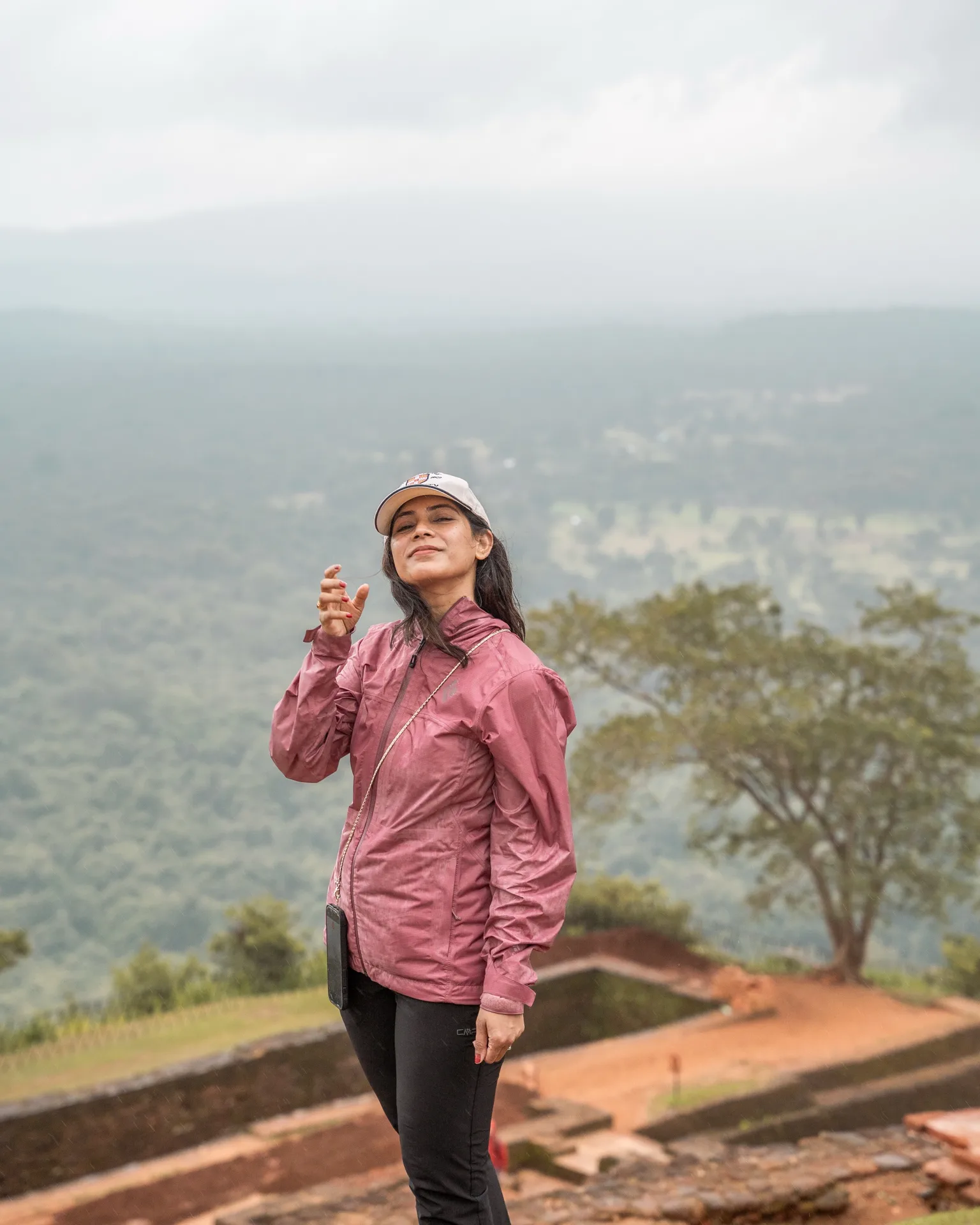 Person enjoying view from hillside.