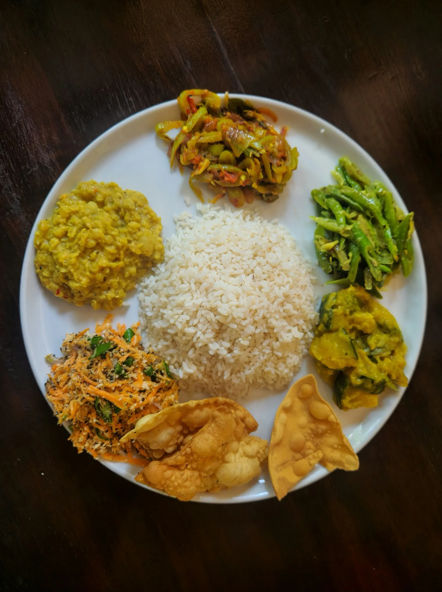 Colourful plate of rice and curries