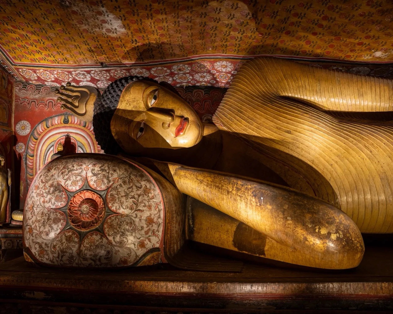 Reclining Buddha statue in cave