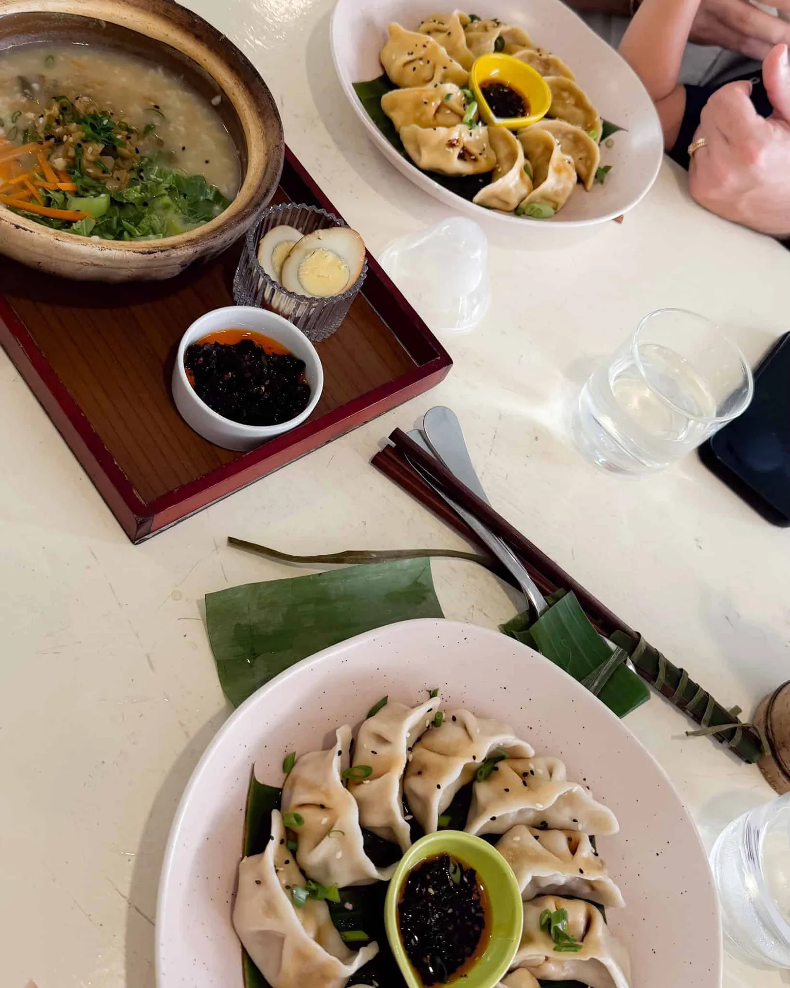 Dumplings and soup on a table.