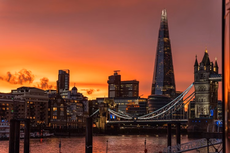 London skyline at sunset with Tower Bridge and The Shard above the River Thames