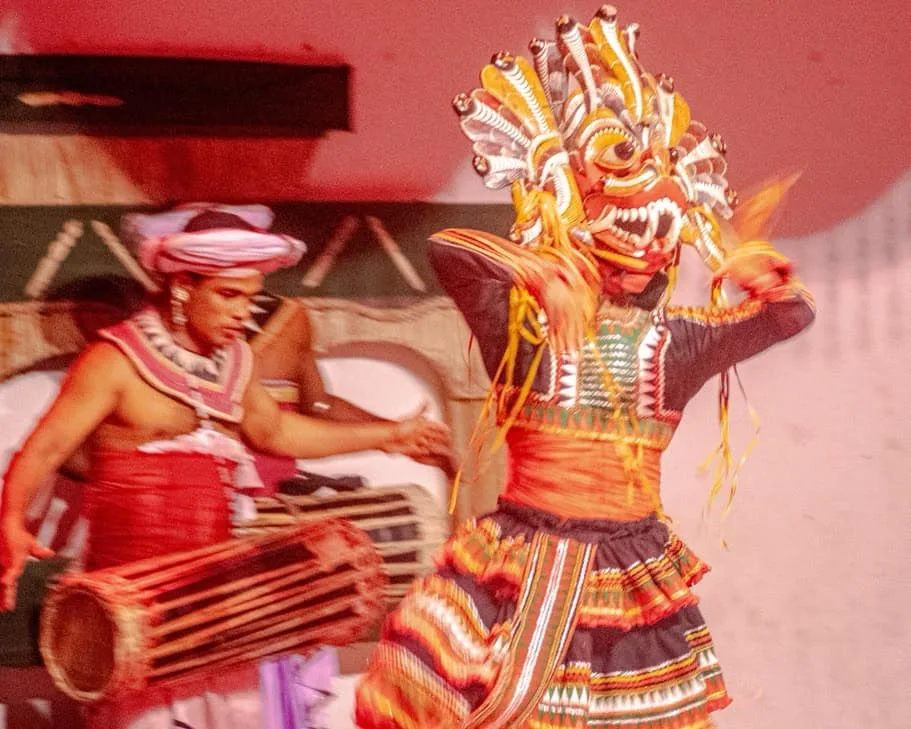Traditional dancers performing with instruments.